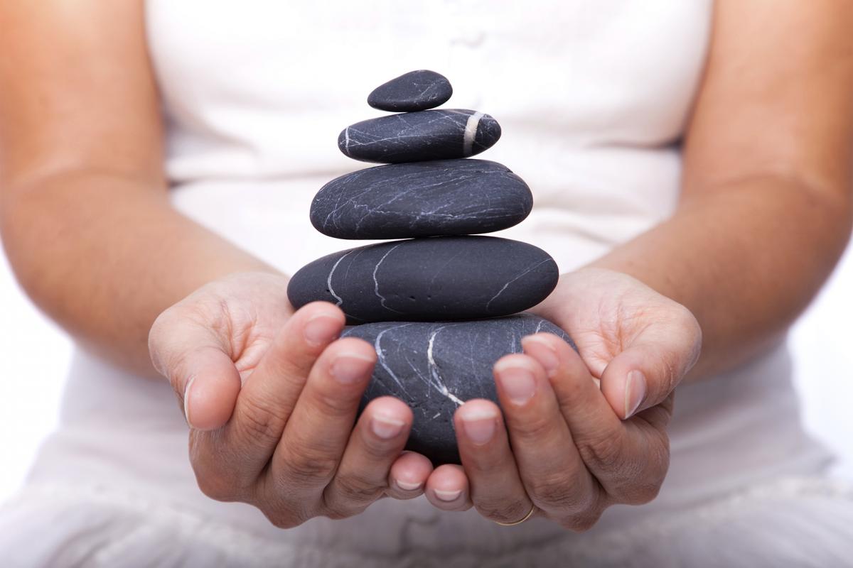 Hands holding cairns