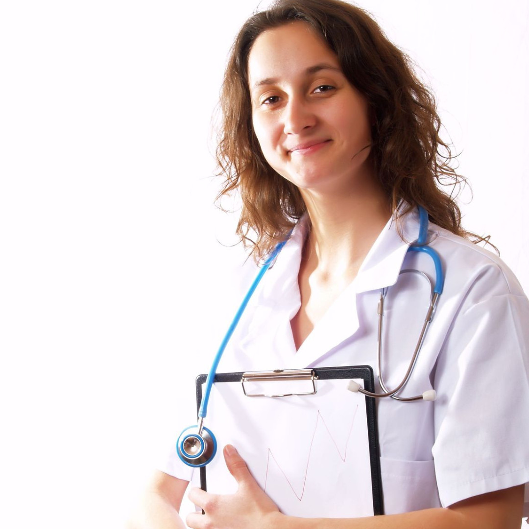 Woman in white lab coat with a stethoscope and clipboard