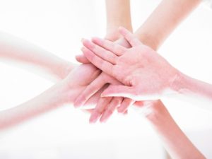 friends joining hands