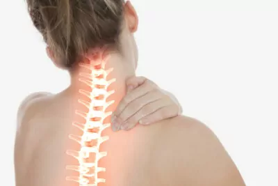 Woman with neck soreness and highlighted spine