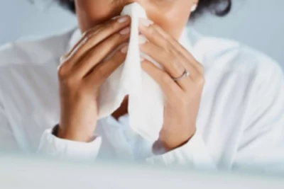 Woman sneezing