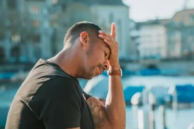 Man with a headache from chronic inflammation