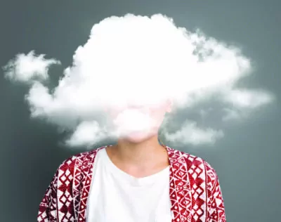 Woman with head in clouds