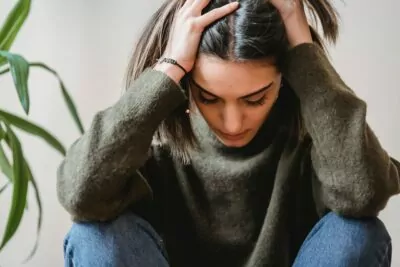 latino woman with headache