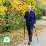 Man walking with Urban Poling Activator poles