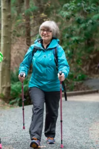 Woman walking with Urban Poling Activator Poles