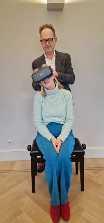 Prof. Floris Wuyts treating MdDS patient with virtual reality goggles.