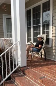 Karen sitting on her porch.