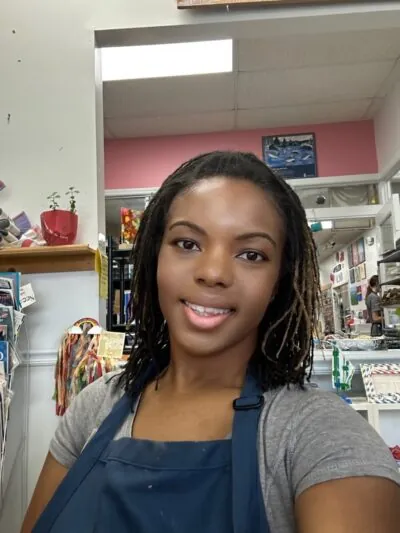 Cherika Gadson in her painting smock.